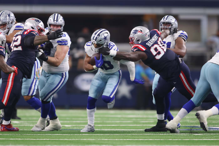 Dallas Cowboys running back Tony Pollard (20) runs the ball during their game against the New England Patriots at AT&T Stadium Sunday. The Cowboys won 38-3.
